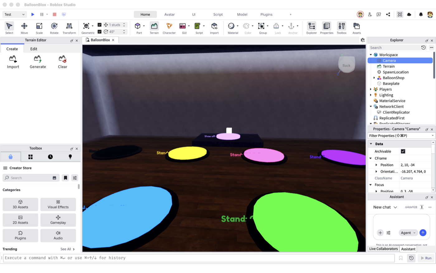 Inside the shop: the grid of glowing balloon pads and the display stage